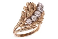 A Modernist diamond-set cocktail ring in the form of a textured foliate, the stylised and layered foliate mount claw-set with five old-cut diamonds, with an estimated total weight of 1.18ct, in unmarked yellow metal surface testing as 14ct, ring head 2.7 