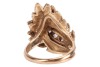 A Modernist diamond-set cocktail ring in the form of a textured foliate, the stylised and layered foliate mount claw-set with five old-cut diamonds, with an estimated total weight of 1.18ct, in unmarked yellow metal surface testing as 14ct, ring head 2.7 - 3