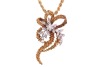 A Modernist diamond-set floral pendant on chain, by Cropp & Farr, the applied foliate motif centred with a round brilliant-cut diamond cluster, with leaves adorned with single-cut diamonds, on a stylised bow mount with beaded textures, London 1973, 5.0 cm