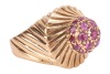 A ruby-set dress ring, featuring a central raised domed cluster of nineteen claw-set round-cut rubies, the domed cluster tapering to a border detailed with diagonal fluting, the diagonal fluting extending to the shoulders, to a plain yellow metal band sur - 3