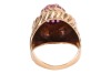 A ruby-set dress ring, featuring a central raised domed cluster of nineteen claw-set round-cut rubies, the domed cluster tapering to a border detailed with diagonal fluting, the diagonal fluting extending to the shoulders, to a plain yellow metal band sur - 4