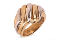 A two-tone dress ring in 18ct gold, of diagonally fluted design, bearing British import marks, size N, 8.8 grams.