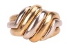 A two-tone dress ring in 18ct gold, of diagonally fluted design, bearing British import marks, size N, 8.8 grams. - 2