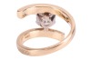 A diamond solitaire ring, of Modernist-style crossover design, composed of a round brilliant diamond measuring approximately 7.25mm with an estimated carat weight of 1.49ct, in a six-prong setting, to a crossover mount, with textured design, hallmarked 18 - 4
