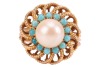 A cultured pearl and turquoise-set dress ring, the cultured pearl surrounded by round turquoise cabochons, with a filigree surround of floral design, to a multi-wire yellow metal shank, with Arabic marks for 18ct, size N; 6.4 grams - 2