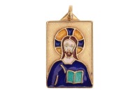 An enamel religious pendant; the rectangular pendant with Florentine finish, depicting a Medieval-style Jesus, set with polychromatic champleve enamel, suspended from a loop bail, in yellow metal bearing Italian assay marks '750', and maker's mark for Tra