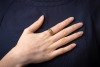 A braided ring in 18ct yellow gold, of woven design leading to tapering shank, London 1919, size S&frac12;, 5.4 grams. - 5