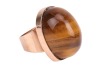 A tiger's eye pinky ring, featuring a large tiger's eye high dome cabochon, measuring 20.7 x 16.6 x 10.3 mm, in a collet to a wide tapering flat shank, yellow metal marked 'K14', size E, 12.8 grams. - 4