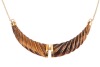 A tiger's eye necklace and a bracelet; the necklace comprising a hinged tiger's eye pendant carved as a twisted horn, with applied stripe decorations, on a fine cable link chain with spring-ring clasp, in yellow metal struck with Italian assay marks for 1 - 2