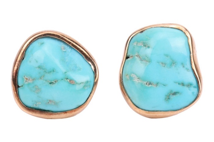 A pair of turquoise-set earrings, with irregular-shaped polished turquoise, bezel-set in yellow metal mounts, with ear clips to the reverse, surface tested as 9ct; 6.5 grams Please note: Unless otherwise stated, lots have been tested using an electronic t
