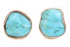 A pair of turquoise-set earrings, with irregular-shaped polished turquoise, bezel-set in yellow metal mounts, with ear clips to the reverse, surface tested as 9ct; 6.5 grams Please note: Unless otherwise stated, lots have been tested using an electronic t