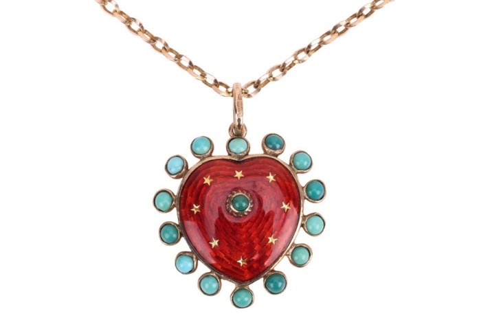 A gem-set enamel heart pendant on chain, the heart-shaped pendant with red transparent enamel and embellished with star motifs, edged with a frame of round turquoise cabochons, 3.1 cm drop, with loop bail suspending on a 53.0 cm long knife-edged cable lin