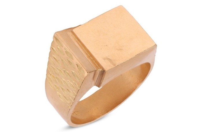 A Modernist ring, the quadrilateral ring head is constructed by two submerging stepped squares, carved pattern on shoulders, to tapering flat shank, yellow metal marked '18ct OBLO', ring size Y, ring head measures 1.8 x 1.5 cm, total weight of item 18.0 g