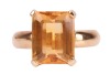 A citrine dress ring, claw-set with a rectangular citrine with canted corners, measures 9.9 x 8.0 x 4.9 mm, to a D-profile shank in yellow metal stamped '18ct' also surface testing as 18ct, size H, 4.8 grams. Please note: Unless otherwise stated, lots hav - 2