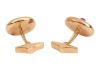 A pair of ruby-set cufflinks, of polished disc form, each centred with an applied round ruby cabochon, toggle fittings to the back, yellow metal stamped '750', signed Serkos and in respective branded case, 1.6 cm wide, 12.5 grams. - 3