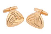 A pair of triangular cufflinks of reeded design, fitted with swivel backs, unmarked yellow metal surface testing as 18ct, cufflink motif measures 2.4 cm across, total weight of item 46.85 grams. Please note: Unless otherwise stated, lots have been tested 