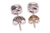 A pair of diamond-set stud earrings, composed of round brilliant diamonds, with an estimated total carat weight of 0.34ct, bezel-set in 18ct white gold mounts, the unassociated white metal earring backs marked &lsquo;9K&rsquo; and the other &lsquo;925&rsquo;; 2.1 grams - 2