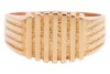 A signet ring with parallel ridged decoration, to a tapering flat shank stamped '18ct', size Z, 15.53 grams. - 2