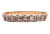 A diamond-set half hoop ring, claw-set with seven single-cut diamonds, to a bi-colour metal mount marked &lsquo;18ct&rsquo; and &lsquo;Plat&rsquo;, size Q; 2.3 grams - 2