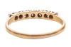 A diamond-set half hoop ring, claw-set with seven single-cut diamonds, to a bi-colour metal mount marked &lsquo;18ct&rsquo; and &lsquo;Plat&rsquo;, size Q; 2.3 grams - 3