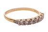 A diamond-set half hoop ring, claw-set with seven single-cut diamonds, to a bi-colour metal mount marked &lsquo;18ct&rsquo; and &lsquo;Plat&rsquo;, size Q; 2.3 grams - 4