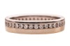 A diamond-set eternity band, in 18ct white gold, channel-set with round brilliant diamonds, to a flat-shaped band measuring approximately 4.2mm wide, size N; 4.6 grams - 2
