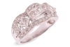 An Art Deco style diamond-set ring, centrally set with a row of four princess-cut diamonds, flanked by an additional two bezel-set princess-cut diamonds, between two scalloped rows of round brilliant-cut diamonds, to a white metal mount marked &lsquo;18K&rsquo; and &lsquo;