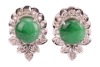A pair of jadeite and diamond-set cluster earrings, of foliate design, centrally-set with a round jadeite cabochon, surrounded by round brilliant diamonds, in an unmarked white metal mount, surface tested as 18ct, with post fittings to the reverse and but