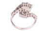 A diamond-set crossover-style ring, featuring a central round brilliant diamond, measuring approximately 9.1mm x 5.2mm, with an estimated carat weight of 3.00ct and an estimated colour and clarity grade of J/K and I2, the crossover-style shoulders each cl - 3