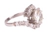 A diamond-set crossover-style ring, featuring a central round brilliant diamond, measuring approximately 9.1mm x 5.2mm, with an estimated carat weight of 3.00ct and an estimated colour and clarity grade of J/K and I2, the crossover-style shoulders each cl - 4
