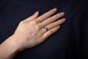 A diamond-set toi et moi ring, composed of two round brilliant diamonds, measuring approximately 5.8mm, with an estimated total carat weight of 1.50ct, claw-set in a crossover design, in an 18ct white gold mount, size N1/2; 5.0 grams - 6