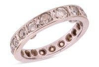A diamond-set full eternity ring, grain-set with old-cut diamonds, of various sizes, in an unmarked white metal mount, surface tested as 18ct, size K (measured with beads); 4.7 grams Please note: Unless otherwise stated, lots have been tested using an ele