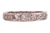 A diamond-set full eternity ring, grain-set with old-cut diamonds, of various sizes, in an unmarked white metal mount, surface tested as 18ct, size K (measured with beads); 4.7 grams Please note: Unless otherwise stated, lots have been tested using an ele - 2