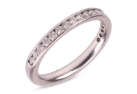 A diamond-set half-eternity ring, featuring a channel of nineteen round brilliant-cut diamonds, set in platinum, size J, 3.5 grams.
