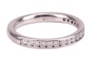 A diamond-set half-eternity ring, featuring a channel of nineteen round brilliant-cut diamonds, set in platinum, size J, 3.5 grams. - 3