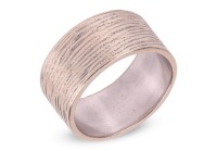 A wedding band, of a wide flat shank forged with bark effect texture, rubbed assay marks, white metal surface testing as 14ct, size L&frac12;, 6.7 grams. Please note: Unless otherwise stated, lots have been tested using an electronic tester. This is a surface te