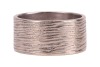 A wedding band, of a wide flat shank forged with bark effect texture, rubbed assay marks, white metal surface testing as 14ct, size L&frac12;, 6.7 grams. Please note: Unless otherwise stated, lots have been tested using an electronic tester. This is a surface te - 2