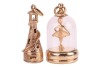 Two 9ct gold pendant charms, including a lighthouse, the interior with a cultured pearl and signed by Litacharm, the second pendant depicting a ballerina in a glass cloche, hallmarked Birmingham 1964; 22.0 grams (2)