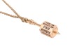 A spinner pendant on chain, featuring a stylised spinning top pendant engraved with levels of affection such as 'with all his heart' and 'he loves me not', surface testing as 18ct, the pendant to a yellow metal rope link chain surface testing as 9ct, meas - 3