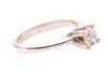 A diamond solitaire ring, consisting of a round brilliant-cut diamond with an estimated weight of 0.35ct, mounted in a high-profile claw setting, between tapered shoulders, in unmarked white metal surface testing as 14ct, size J, 3.0 grams. Please note: U - 4