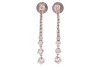 A pair of diamond-set drop earrings, of tapering design, each claw-set with thirteen graduated round brilliant diamonds, in 18ct white gold mounts, with post fittings and earring backs to the reverse; 2.6 grams