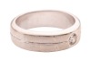 A diamond-set dress ring, flush-set with a round brilliant-cut diamond with an estimated weight of 0.20ct, to a band with a central indentation, Indian assay marks '750', size P, 10.0 grams. - 3