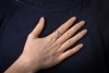 A diamond-set dress ring, flush-set with a round brilliant-cut diamond with an estimated weight of 0.20ct, to a band with a central indentation, Indian assay marks '750', size P, 10.0 grams. - 5