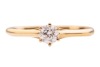 A diamond solitaire ring, composed of a round brilliant-cut diamond, with an estimated carat weight of 0.20ct, in a six-prong setting, with tapered shoulders leading to a D-profile shank, in unmarked yellow metal surface tested as 18ct, size N1/2; 1.9 gra - 2