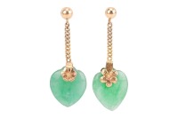 A pair of jade heart drop earrings, each consisting of a carved heart-shaped jadeite, on a flowerhead surmount, chain suspended from an ear post and butterfly fitting, unmarked yellow metal surface testing as 18ct, overall drop length 3.0 cm, 3.2 grams. P