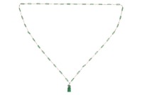 A long jadeite link chain, comprising a series of Figaro links, flanked by faceted jadeite bar links with a chamfered edge, suspending a carved jadeite Fuu dog seal with vacant panel, yellow metal surface testing as 14ct, with a gilt suspension loop bail,