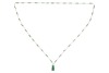 A long jadeite link chain, comprising a series of Figaro links, flanked by faceted jadeite bar links with a chamfered edge, suspending a carved jadeite Fuu dog seal with vacant panel, yellow metal surface testing as 14ct, with a gilt suspension loop bail,