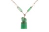 A long jadeite link chain, comprising a series of Figaro links, flanked by faceted jadeite bar links with a chamfered edge, suspending a carved jadeite Fuu dog seal with vacant panel, yellow metal surface testing as 14ct, with a gilt suspension loop bail, - 3