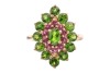 A chrome diopside and garnet cluster ring in 9ct yellow gold, the navette-shaped cluster centred with an oval-cut chrome diopside, framed by a frame of circular-cut garnets and an outer frame of circular-cut diopsides, between tapered shoulders, British h - 2