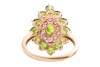 A chrome diopside and garnet cluster ring in 9ct yellow gold, the navette-shaped cluster centred with an oval-cut chrome diopside, framed by a frame of circular-cut garnets and an outer frame of circular-cut diopsides, between tapered shoulders, British h - 3
